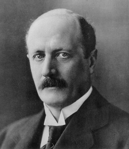 Black and white studio portrait of Sven Wingquist in a suit and tie